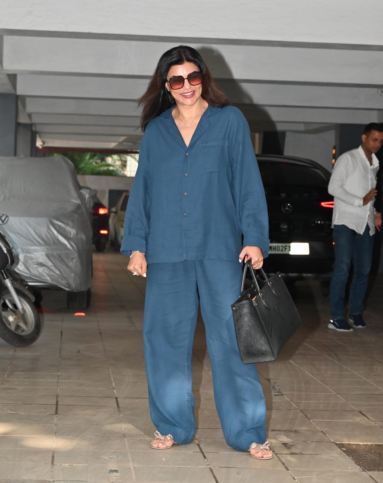 Sushmita Sen was spotted in the city today wearing an oversized denim co-ord set featuring a shirt and pants. She paired it with sunglasses and a chic black handbag.